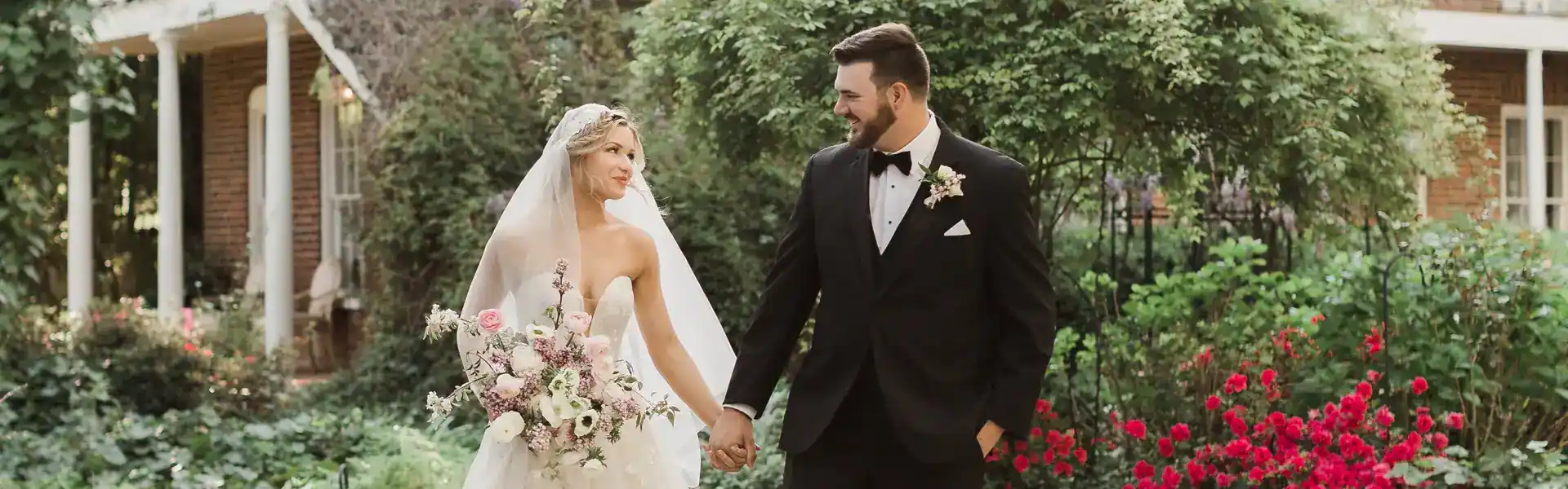 Groom wearing a big and tall style suit with his bride