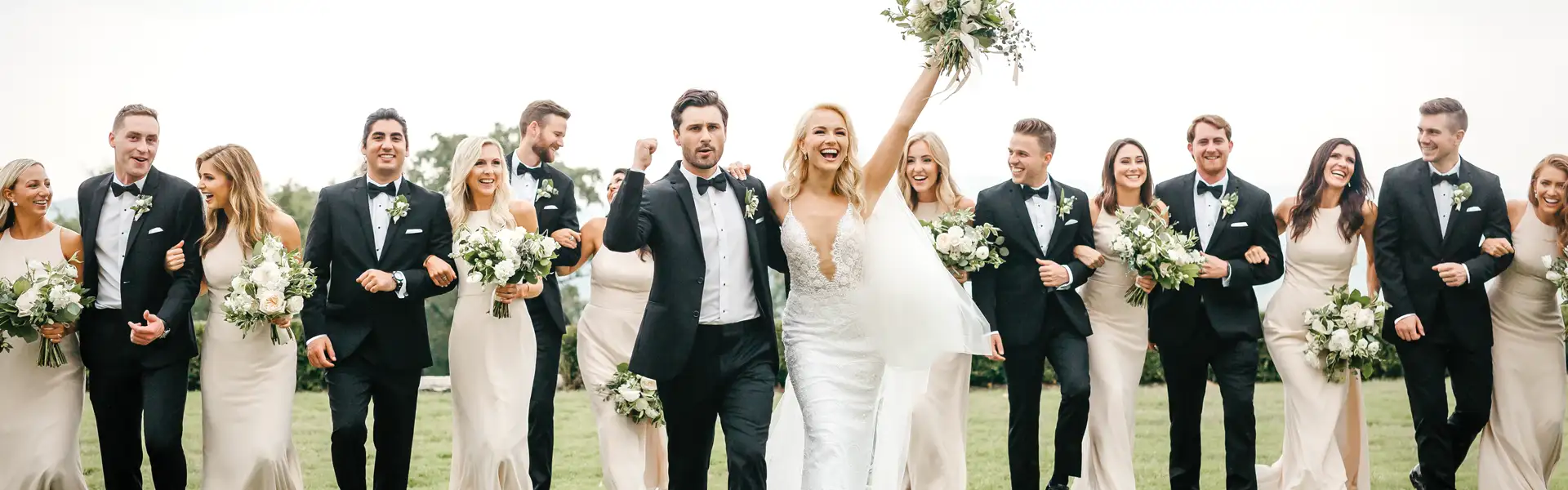 Wedding party cheering after the wedding