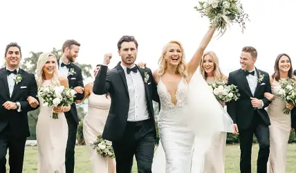 Wedding party cheering after the wedding
