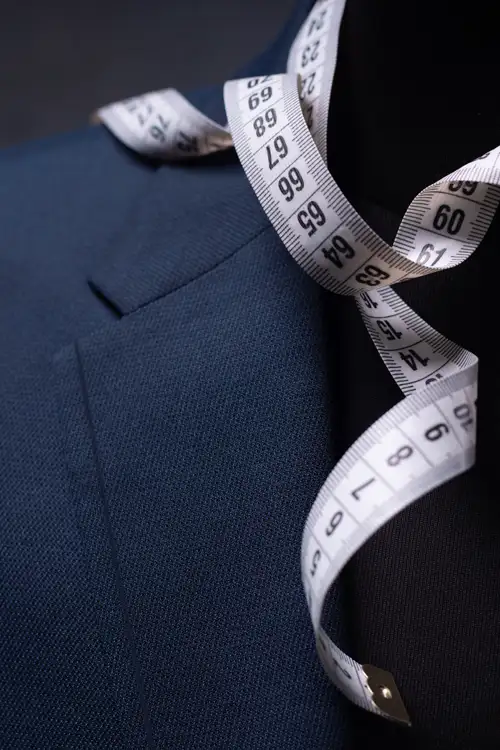 Measuring tape hanging on a suit to help find your perfect fit