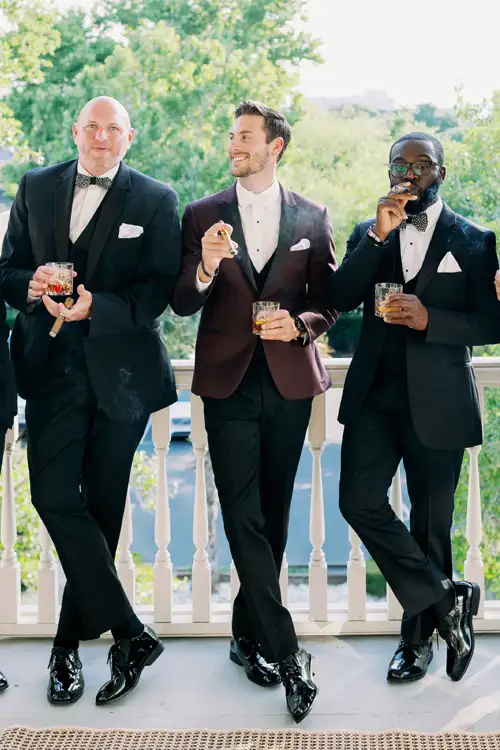 Groomsmen enjoying drinks together